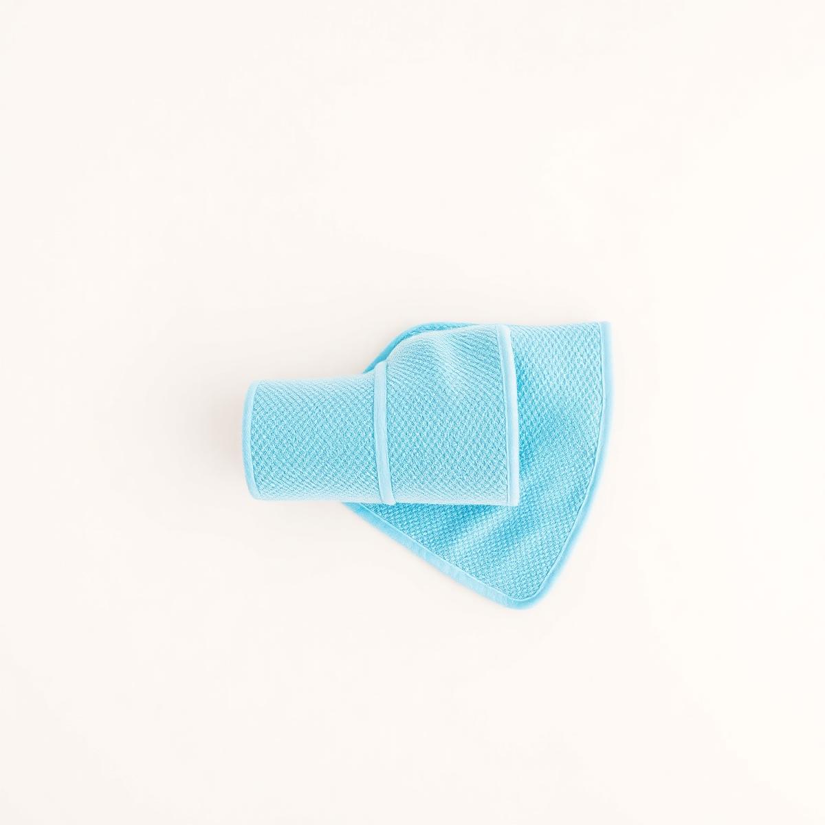 LoveCool Towel in sky blue, rolled and ready to use